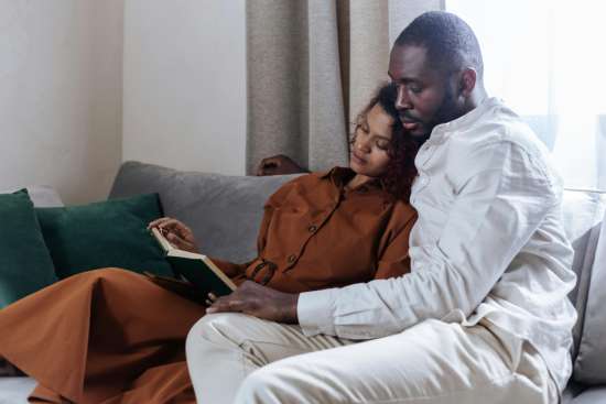 A couple reading the Bible as they prepare for marriage