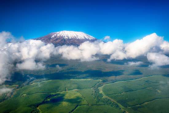 Mount Kilimanjaro, surrounded by clouds, an evidence of God's beautiful Creation