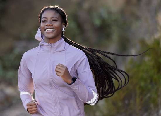 A young woman enjoys God's beautiful creation while exercising, just as the health message suggests.
