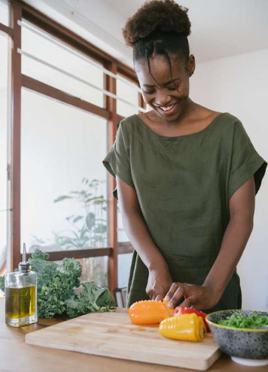 A woman cutting vegetables in preparation for a Sabbath meal