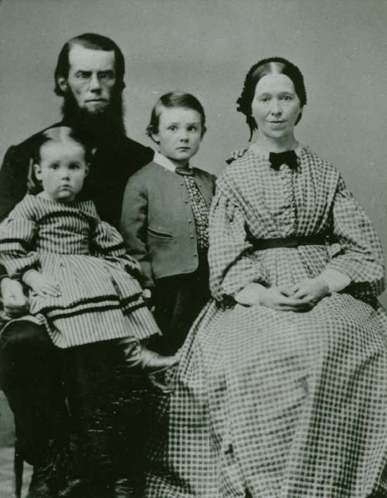 A portrait of JN Andrews, his wife Angeline, and his first two children: Charles and Mary.