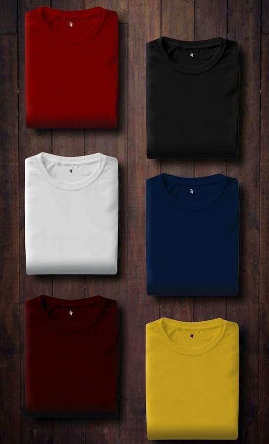Two columns of carefully folded t-shirts of varying colors.