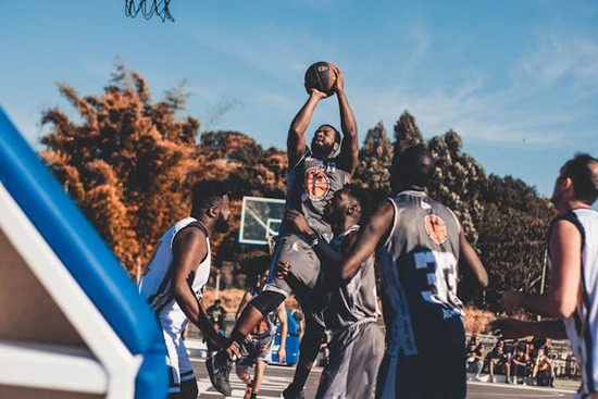 Adventist students playing basketball as part of an athletics program