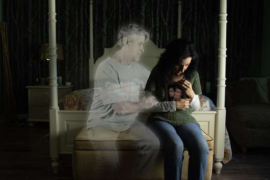 The appearance of a ghost comforting a woman who has lost a loved one