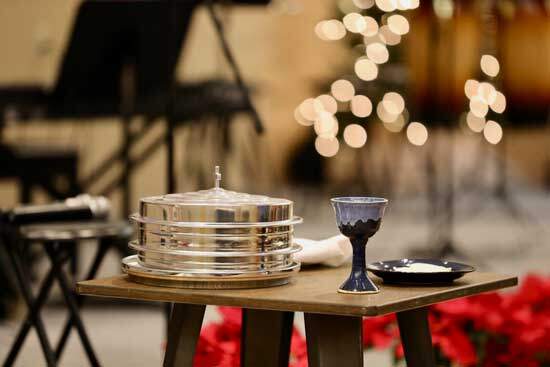 Communion trays and a glass of grape juice at a Seventh-day Adventist Church