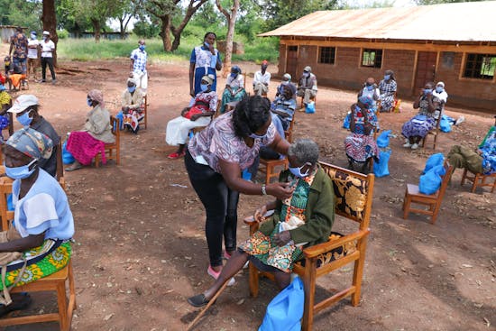 A woman doing good work to provide medical aid to those need in an African village